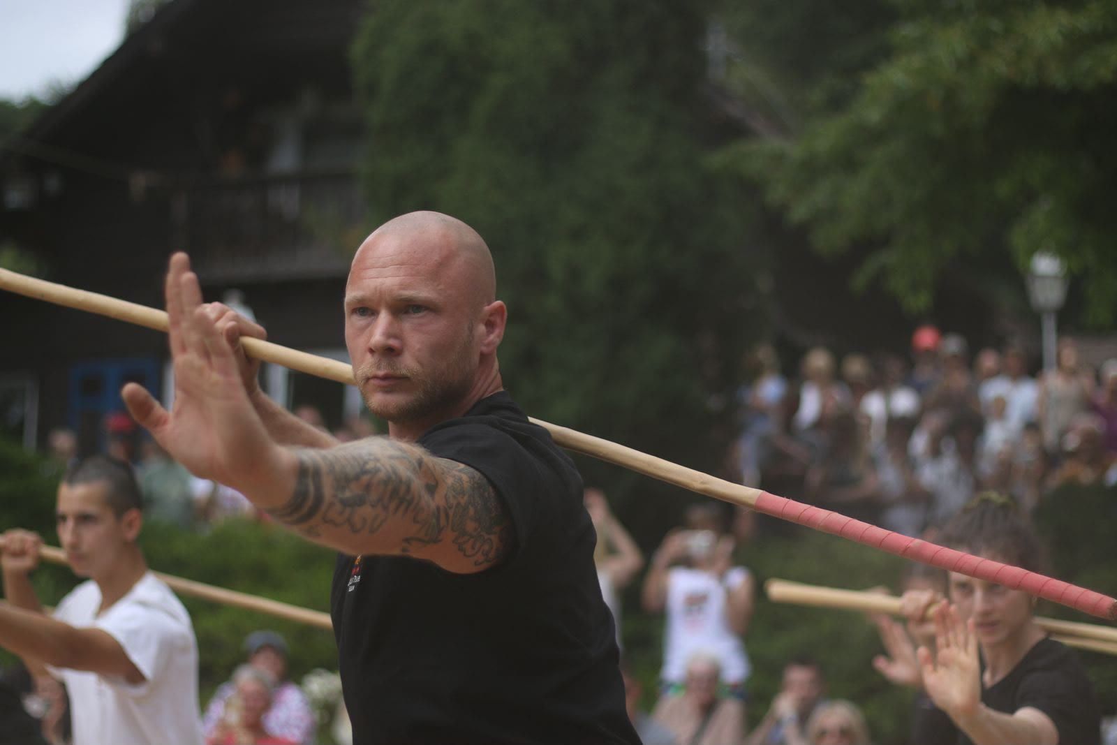 Julian Jacobi with the long staff, his students behind him